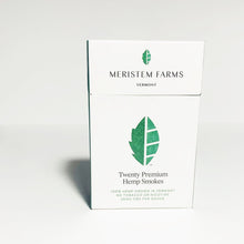 Load image into Gallery viewer, Product displayed resembles a white classic cigarette pack with a large seed/stem logo that is various shades of textured green.  The company logo is on the front flap and the text is in green label with font Manrope.  Pack is viewed from the front on a white background.