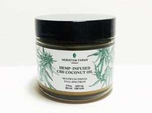 glass jar with white label includes green botanical drawings of hemp or cannabis plants with label text in black along with company logo.  Jar lid is black.  Photo is on a white background.
